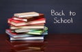 Pile of books on the desk. The words 'Back to School' written Royalty Free Stock Photo