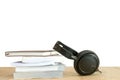 Pile of books with earphone on wooden table. Royalty Free Stock Photo