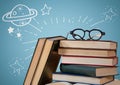 Pile of books and glasses with white space doodles against blue background Royalty Free Stock Photo