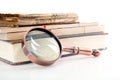 A pile of books and magnifiers on a white background