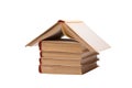 Pile of books with one opened like house roof Royalty Free Stock Photo