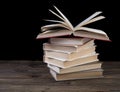 Pile of books and an open book Royalty Free Stock Photo