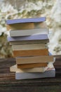 A pile of books on a wooden table Royalty Free Stock Photo