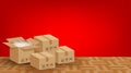 Pile boxes brown placed on the parquet floor in the red room empty, cardboard carton box and copy space ad, stack cardboard box Royalty Free Stock Photo