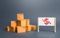 Pile of boxes and easel with red dollar arrow down chart. Drop profits, sales slowdown. Decrease in trade volumes, commodity Royalty Free Stock Photo