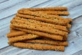 Pile of Breadsticks, also known as grissini, grissino or dipping sticks, pencil-sized sticks of crisp, dry baked bread salty with