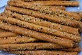 Pile of Breadsticks, also known as grissini, grissino or dipping sticks, pencil-sized sticks of crisp, dry baked bread salty with