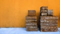 Pile of Bricks in Front of Orange Wall Close Up Royalty Free Stock Photo