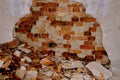 pile of bricks lying around, ruined wall in abandoned building, shelter, concept of destruction of buildings from earthquake,