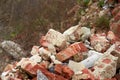 A pile of bricks among the ruins of a factory