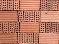 An orderly stack of bricks on a construction site.