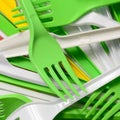 Pile of bright yellow, green and white used plastic kitchenware appliances Royalty Free Stock Photo