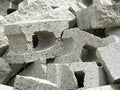 Pile of broken concrete bricks ready to be recycled on a construction and demolition waste management site