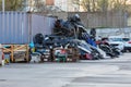 pile of broken plastic car bumpers behind a car dealership and service center Royalty Free Stock Photo