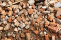 A pile of broken red bricks. Broken bricks close up. Construction debris Royalty Free Stock Photo