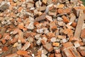 A pile of broken red bricks and fragments of concrete. Construction debris Royalty Free Stock Photo