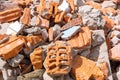 A pile of broken red bricks and fragments of concrete - a destroyed building. Broken bricks close up. Demolition or Royalty Free Stock Photo