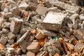 A pile of broken red bricks and fragments of concrete - a destroyed building. Broken bricks close up. Demolition or Royalty Free Stock Photo