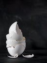 A pile of broken white egg shells on a dark background Royalty Free Stock Photo
