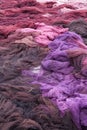 Pile of brown, violet and pink fishing nets