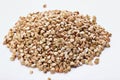Pile of buckwheat seeds isolated on white background, closeup Royalty Free Stock Photo
