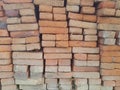 A pile of building materials, stack of new red bricks for construction. Red brick background for graphic design Royalty Free Stock Photo