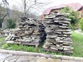 Pile of building materials on street in countryside. Close up of stone tiles on ground outdoor. Concept of constructing