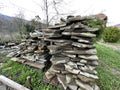 Pile of building materials on street in countryside. Close up of stone tiles on ground outdoor. Concept of constructing