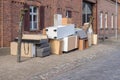 Pile of bulky waste with furniture on the side of the road Royalty Free Stock Photo