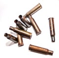 A pile bullet shells on a white background