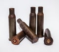 A pile bullet shells on a white background