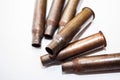 A pile bullet shells on a white background