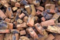 Pile of burnt brown orange old defective bricks Royalty Free Stock Photo