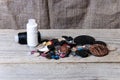 Pile of buttons, black and white thread, needle Royalty Free Stock Photo
