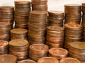 A pile of Canadian one cent coins and United States pennies Royalty Free Stock Photo