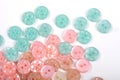 Pile of candy button for sewing on white background