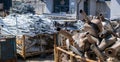 A pile of car mufflers at the junkyard