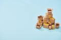 Pile of cardboard boxes on blue background with copy space. Royalty Free Stock Photo