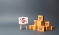 A pile of cardboard boxes and stand with a red down arrow. decline in the production of goods and products, the economic downturn