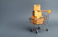 A pile of cardboard boxes in a supermarket trolley. concept of shopping in the online store . E-commerce, sales and sale of goods