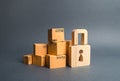 A pile of cardboard boxes and a wooden padlock. concept of insurance purchases. Providing warranty on purchased products. Consumer