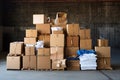 A pile of cardboard trash in front of a garage. Recycling concept