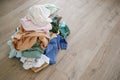 Pile of carelessly scattered clothes on floor