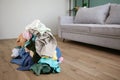 Pile of carelessly scattered clothes on floor