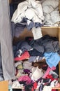 Pile of carelessly scattered clothes in wardrobe