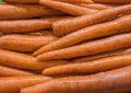 Pile of carrots for background. Shelves with organic natural vegetables in supermarket or farmer market. Fresh food Royalty Free Stock Photo