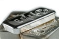 Pile cast silver bullion on a white background. Royalty Free Stock Photo