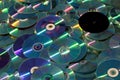 A pile of shiny CDs and DVDs. Royalty Free Stock Photo
