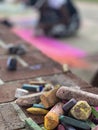 Pile of chalk sits ready to use at local arts festival Royalty Free Stock Photo