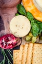 A pile of cheese heads, vegetables, fruits, cookies and nuts on table Royalty Free Stock Photo